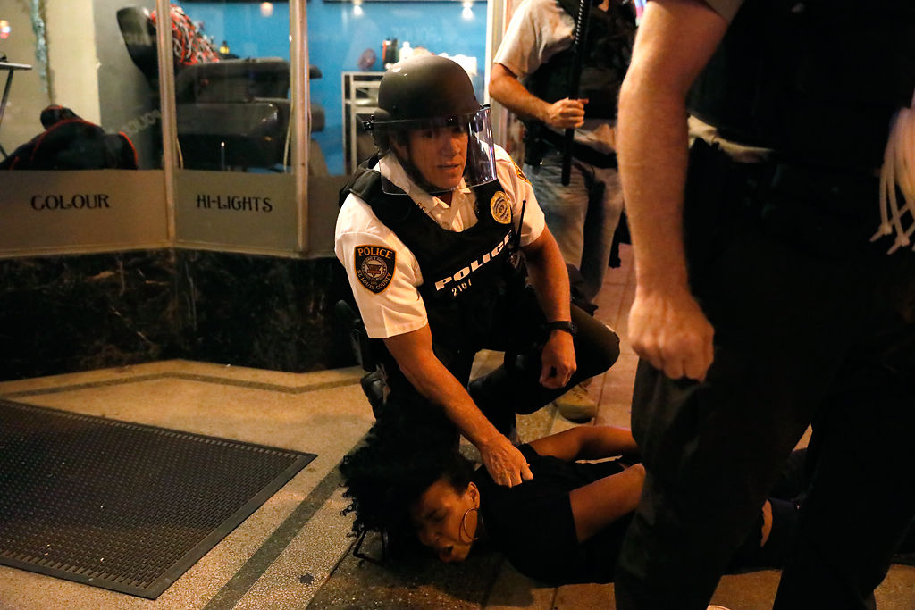 Police arrest a women after sweeping through Delmar Street